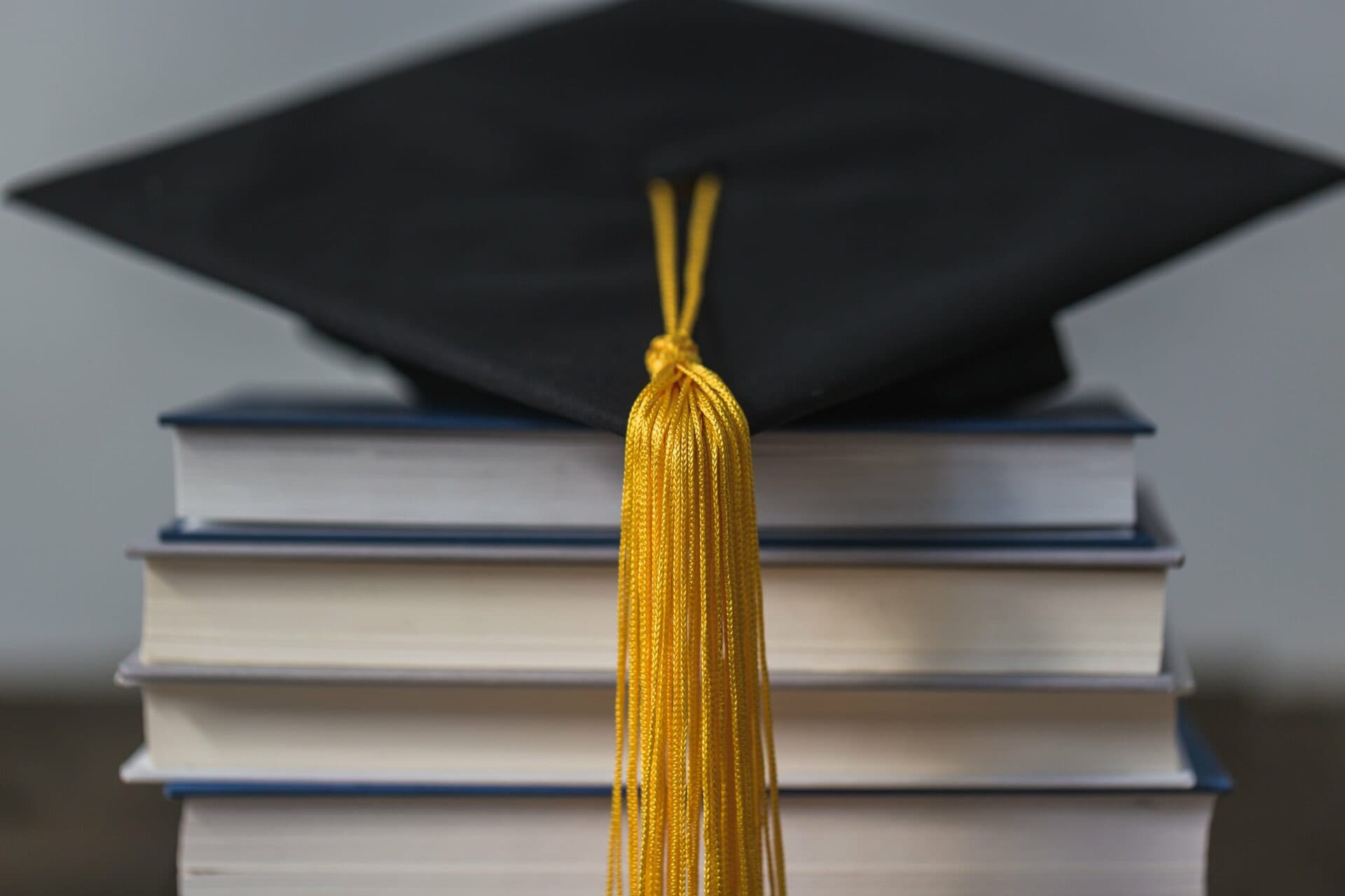 Graduation Cap Gold Tassle And Books